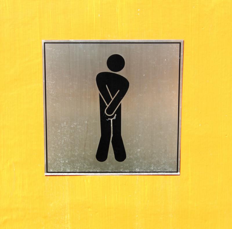 Man urinating sign